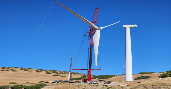 crane constructing wind turbine
