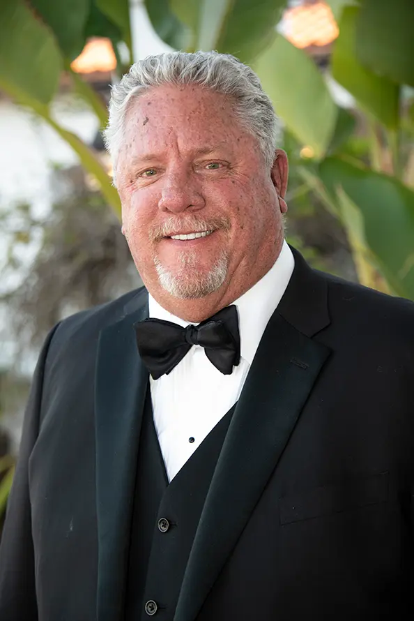 Portrait of Scott Bragg in a tuxedo.